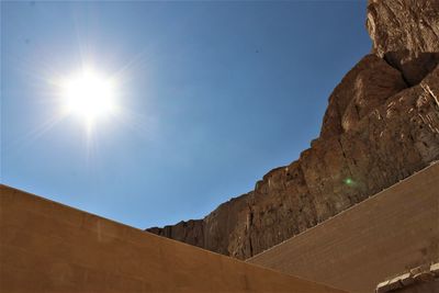 Low angle view of mountain against blue sky