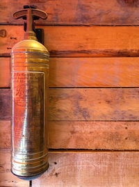 Close-up of beer bottles on wall