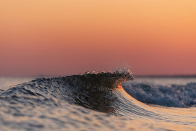 Scenic view of desert against clear sky during sunset