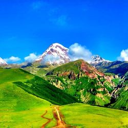 Scenic view of mountains against cloudy sky
