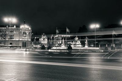 Light trails on road in city at night