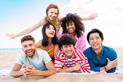 Friends sitting on beach