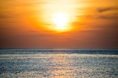 Scenic view of sea against romantic sky at sunset