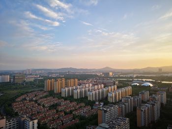 High angle view of buildings in city against sky