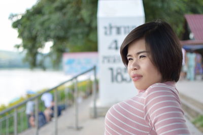 Portrait of woman standing outdoors