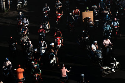 High angle view of people walking on road at night