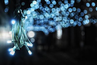 Close-up of illuminated christmas lights at night