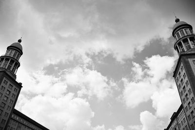 Low angle view of tower against cloudy sky