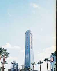 Low angle view of tower against cloudy sky