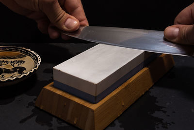 Close-up of man holding table