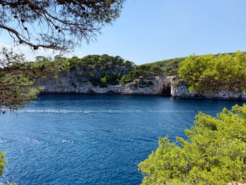 Scenic view of sea against clear blue sky