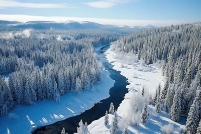 Scenic view of snow covered landscape against sky