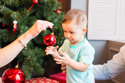 High angle view of woman holding christmas tree