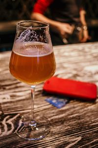 Close-up of beer glass on table