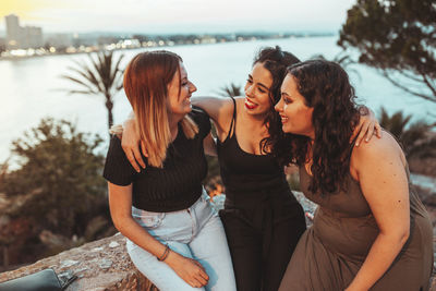 Friends enjoying at sea shore