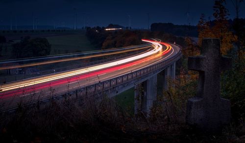 High angle view of light trails on road at night