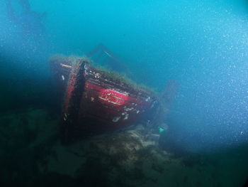 Aerial view of abandoned boat in sea