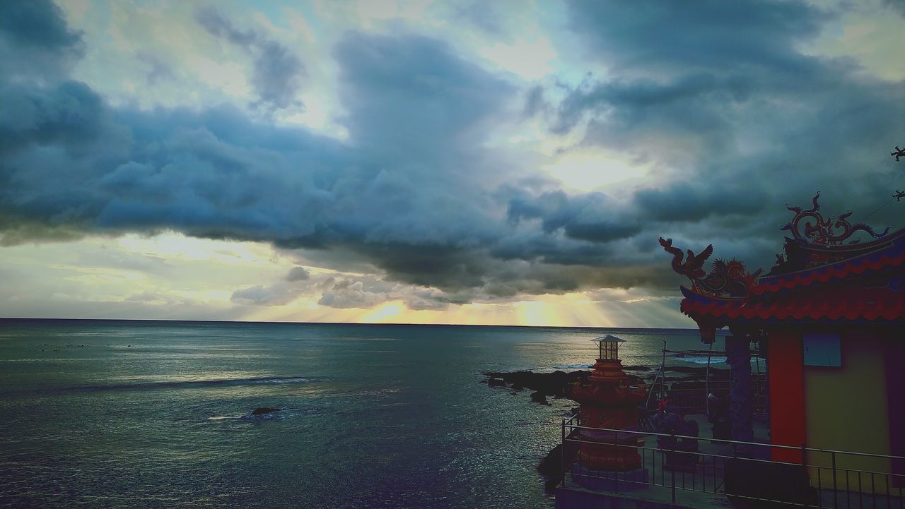 cloud, sky, water, sea, ocean, dusk, evening, nature, architecture, horizon, beauty in nature, sunset, travel destinations, scenics - nature, horizon over water, nautical vessel, reflection, coast, ship, no people, cloudscape, built structure, travel, storm, outdoors, dramatic sky, environment, religion, building, transportation, building exterior, beach, tranquility