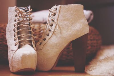 Close-up of high heels on floor at home