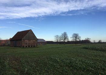 House on field against sky