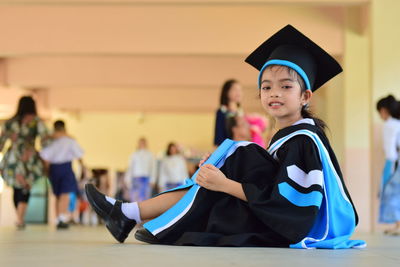 Woman sitting in traditional clothing