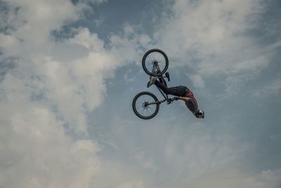 Low angle view of parachute against clear sky