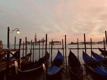 Boats moored in canal