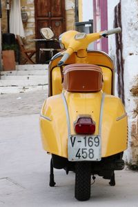 Yellow umbrella on road