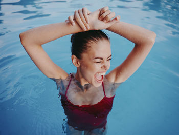 High angle view of woman swimming in pool