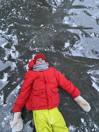 Low section of woman standing on snow