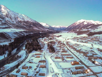 High angle view of snowcapped mountains against clear sky