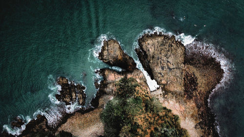 High angle view of rock formation on beach