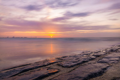 Scenic view of sea against sky during sunset