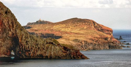 Scenic view of mountains and sea against sky