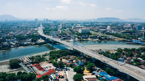 High angle view of river amidst buildings in city