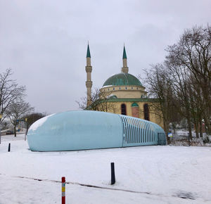 Building against sky during winter