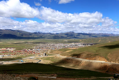 Scenic view of agricultural landscape against sky