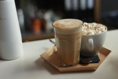 Close-up of coffee served on table