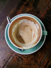 High angle view of coffee cup on table