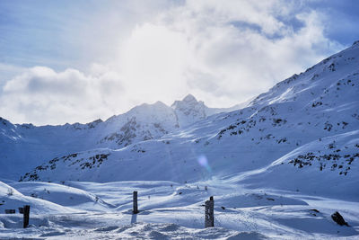 Scenic view of snowcapped mountains against sky