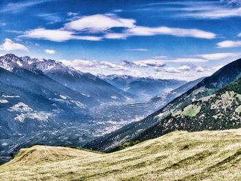 Scenic view of snowcapped mountains against sky