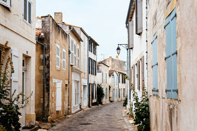 Narrow alley amidst buildings in town