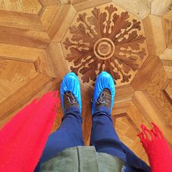 Low section of woman standing on tiled floor