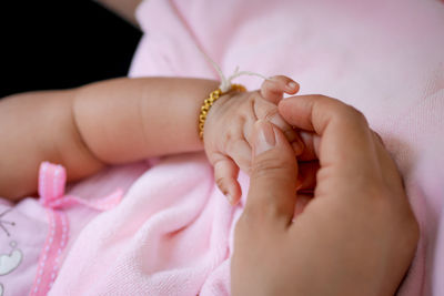 Close-up of baby holding hand