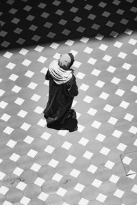High angle view of woman walking on floor