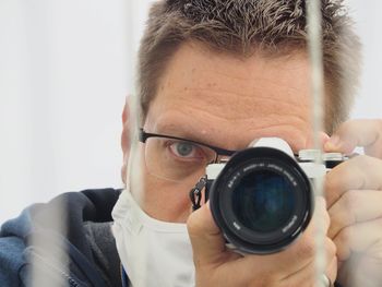 Portrait of man photographing