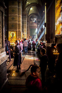 Group of people in temple outside building