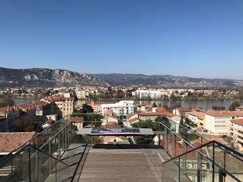 High angle view of townscape against clear blue sky