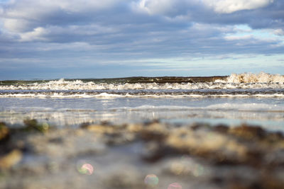 Scenic view of beach against sky