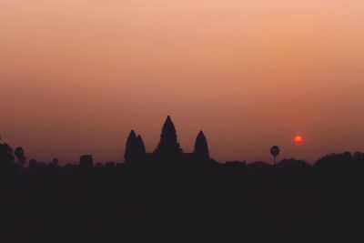 Silhouette temple against sky during sunset